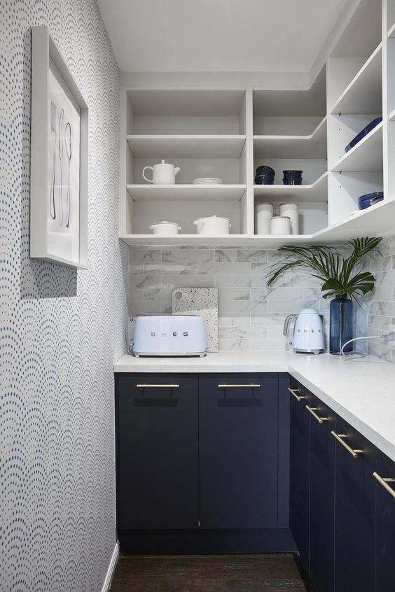 Compact kitchen with kitchen cabinets and benchtop, ideal for small space storage.