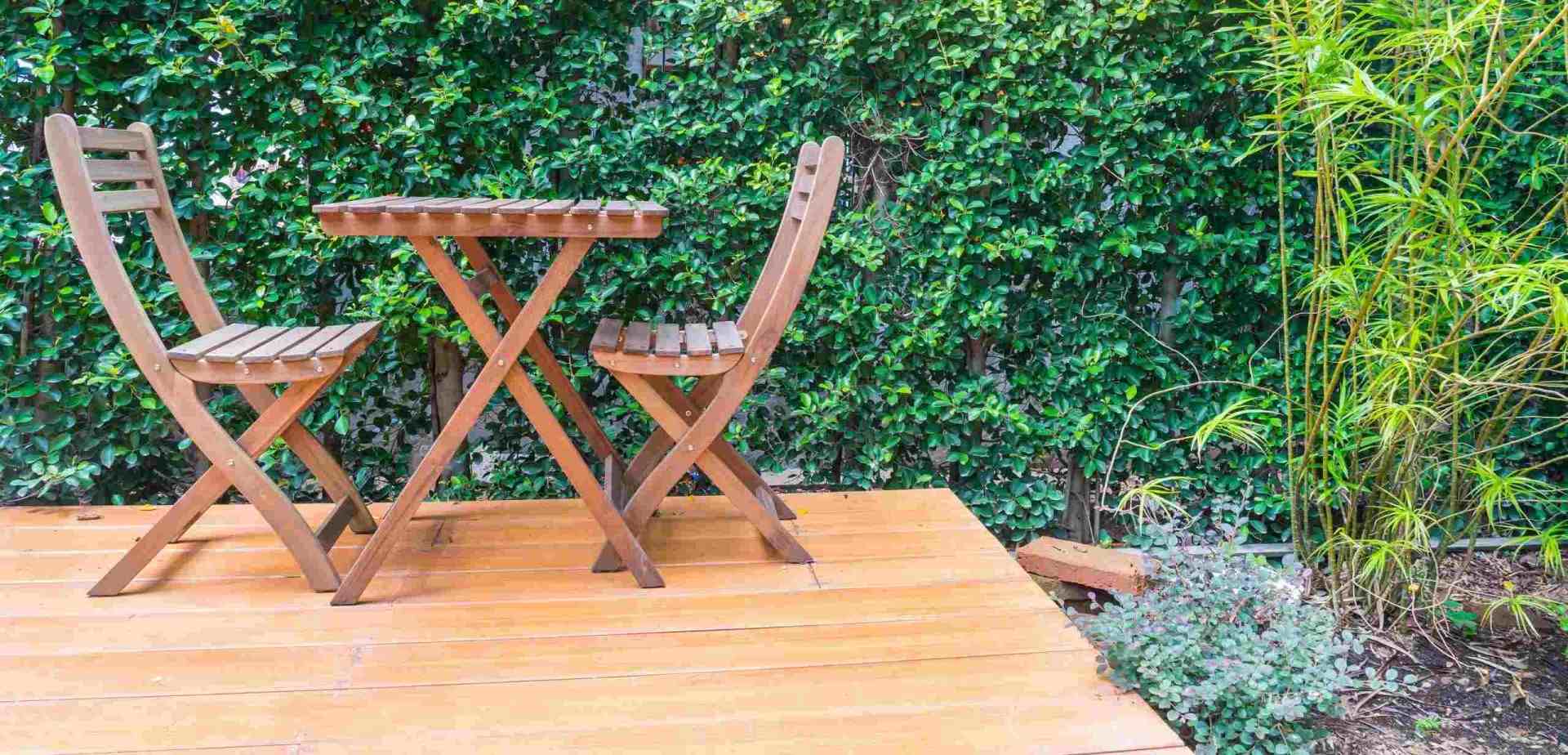 wooden chairs sitting on a deck