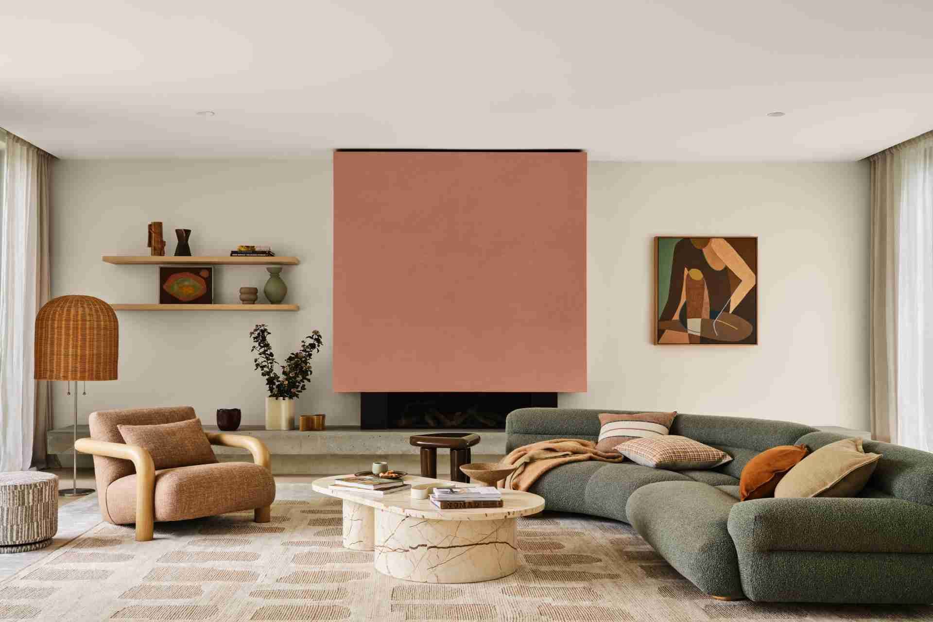 a modern living room with a large curved green sofa